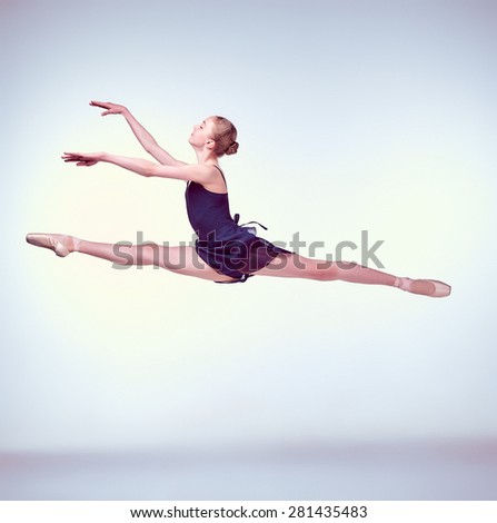 https://thumb1.shutterstock.com/display_pic_with_logo/2639893/281435483/stock-photo-young-ballet-dancer-jumping-on-a-grey-background-ballerina-is-wearing-in-blue-dress-and-pointe-281435483.jpg