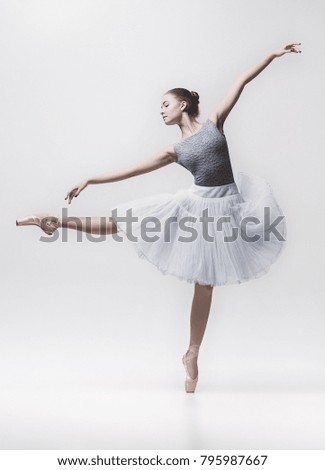Young classical dancer isolated on white background.