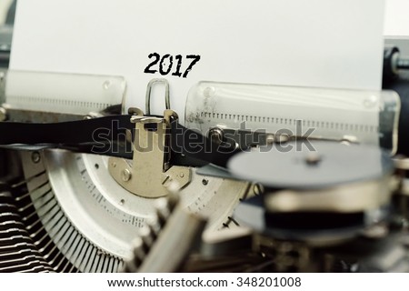 2017 - Paper Sheets in Old Vintage Typewriter . Business concept on Toned, Grain Effect, Shallow Depth Of Field and Blurred Background