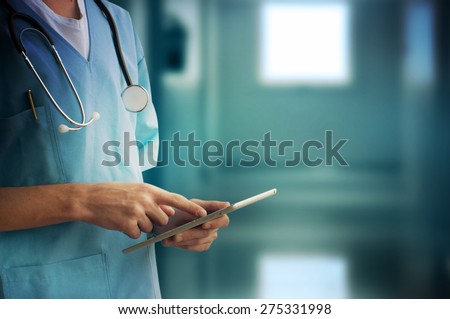 Healthcare And Medicine. Doctor using a digital tablet