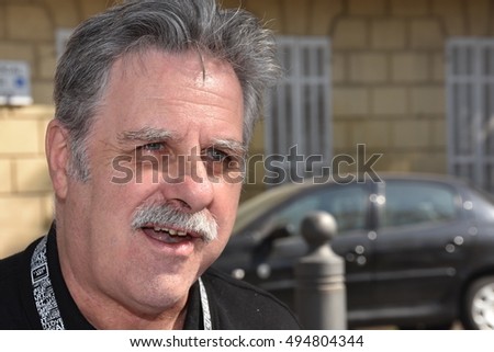 Marseille, France - October 06, 2016 : French cartoonist Alain Roche alias Nalair at the 5th edition of the International festival of press and political cartoons at l'Estaque.