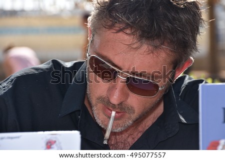 Marseille, France - October 06, 2016 : French cartoonist Tony Gouarch at the 5th edition of the International festival of press and political cartoons at l'Estaque.