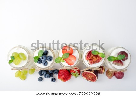 Fresh yogurt. Breakfast with yogurt with fruits and berries. Healthy food concept. Top view. Copy space