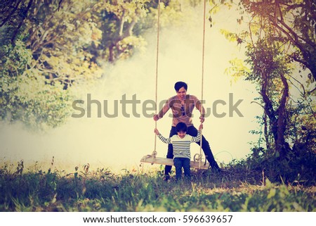Vintage color photo happy joyful father having fun and son, family, travel, father's day - concept. Sunlight