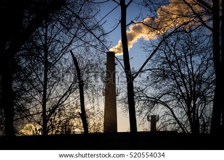 Factory chimneys on the sunset