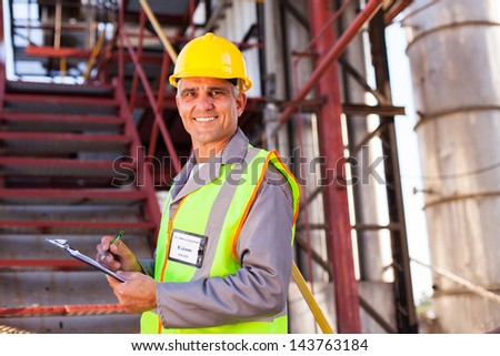 smiling senior petrochemical worker in plant