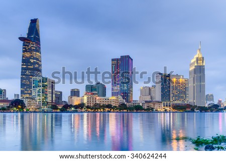 HO CHI MINH CITY, SAIGON/VIETNAM - CIRCA AUGUST 2015: Lights of Saigon downtown skyline are reflected in the river