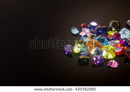 Jewel or gems on black shine color, Collection of many different natural gemstones
amethyst, lapis lazuli, rose quartz, citrine, ruby, amazonite, moonstone, labradorite, chalcedony, blue topaz