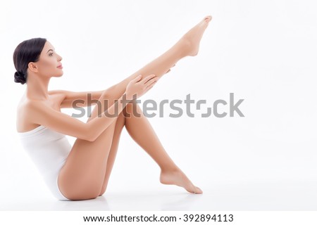 Beautiful young woman is caring of her body