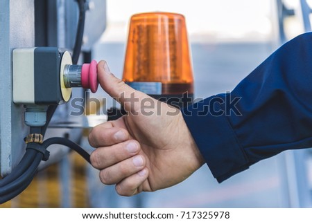 Man finger pushing rubber knob