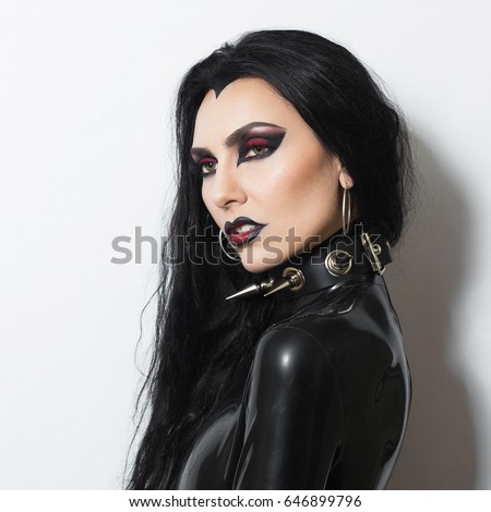 https://thumb1.shutterstock.com/display_pic_with_logo/2729200/646899796/stock-photo-beautiful-dominant-brunette-vamp-fetish-goth-mistress-evil-girl-in-black-latex-dress-and-bdsm-spiky-646899796.jpg