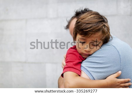 Little sad boy whith his dad