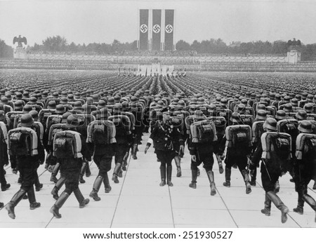 stock-photo-members-of-the-ss-marching-in-formation-on-nazi-party-day-nuremberg-germany-september-251930527.jpg