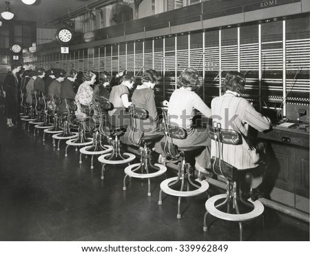 Telephone operators working on an international switchboard in the 1930s Telephone operators working on an international switchboard in the 1930s