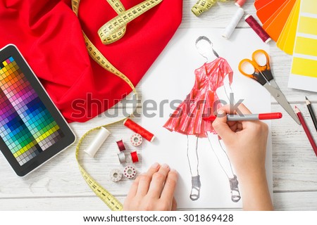 Fashion designer working in studio. Close up design.