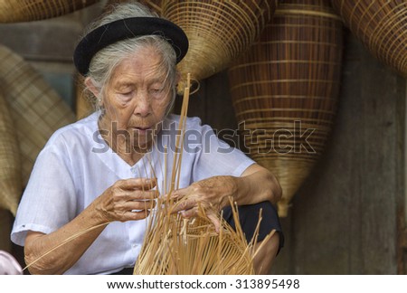 HUNGYEN, VIETNAM - JUNE 21 :Unidentified people weaving bamboo on June 21, 2015 in HungYen, Vietnam. Weaving this tools that used to catch fish is traditional occupation in Hung Yen province.