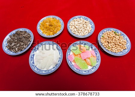 Amazing of Vietnamese food for Tet holiday in spring, jam is traditional food on lunar new year, make from sweet potato, lotus seed, ginger, mango with sugar, colorful background for Vietnam culture