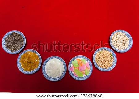 Amazing of Vietnamese food for Tet holiday in spring, jam is traditional food on lunar new year, make from sweet potato, lotus seed, ginger, mango with sugar, colorful background for Vietnam culture