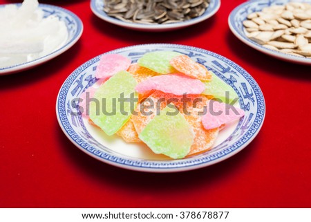 Amazing of Vietnamese food for Tet holiday in spring, jam is traditional food on lunar new year, make from sweet potato, lotus seed, ginger, mango with sugar, colorful background for Vietnam culture