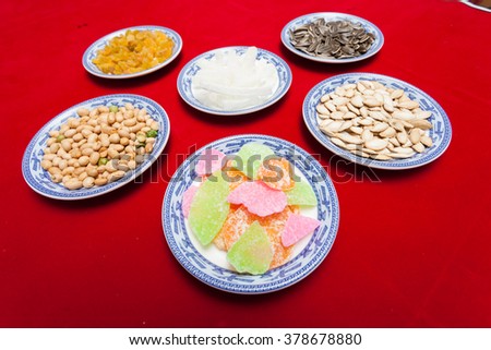 Amazing of Vietnamese food for Tet holiday in spring, jam is traditional food on lunar new year, make from sweet potato, lotus seed, ginger, mango with sugar, colorful background for Vietnam culture
