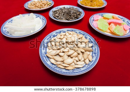 Amazing of Vietnamese food for Tet holiday in spring, jam is traditional food on lunar new year, make from sweet potato, lotus seed, ginger, mango with sugar, colorful background for Vietnam culture