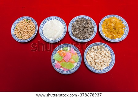 Amazing of Vietnamese food for Tet holiday in spring, jam is traditional food on lunar new year, make from sweet potato, lotus seed, ginger, mango with sugar, colorful background for Vietnam culture