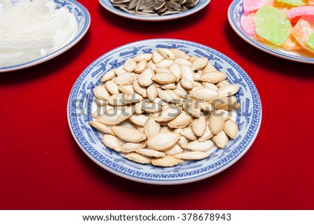 Amazing of Vietnamese food for Tet holiday in spring, jam is traditional food on lunar new year, make from sweet potato, lotus seed, ginger, mango with sugar, colorful background for Vietnam culture