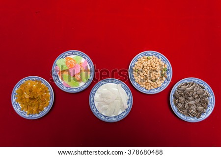 Amazing of Vietnamese food for Tet holiday in spring, jam is traditional food on lunar new year, make from sweet potato, lotus seed, ginger, mango with sugar, colorful background for Vietnam culture