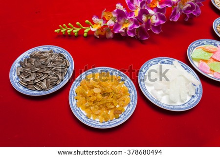 Amazing of Vietnamese food for Tet holiday in spring, jam is traditional food on lunar new year, make from sweet potato, lotus seed, ginger, mango with sugar, colorful background for Vietnam culture