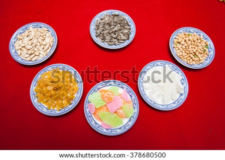 Amazing of Vietnamese food for Tet holiday in spring, jam is traditional food on lunar new year, make from sweet potato, lotus seed, ginger, mango with sugar, colorful background for Vietnam culture
