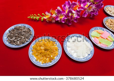 Amazing of Vietnamese food for Tet holiday in spring, jam is traditional food on lunar new year, make from sweet potato, lotus seed, ginger, mango with sugar, colorful background for Vietnam culture