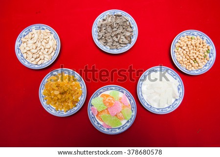 Amazing of Vietnamese food for Tet holiday in spring, jam is traditional food on lunar new year, make from sweet potato, lotus seed, ginger, mango with sugar, colorful background for Vietnam culture