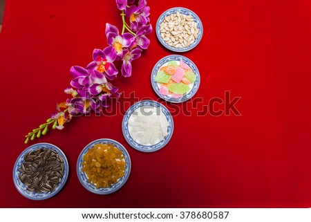 Amazing of Vietnamese food for Tet holiday in spring, jam is traditional food on lunar new year, make from sweet potato, lotus seed, ginger, mango with sugar, colorful background for Vietnam culture