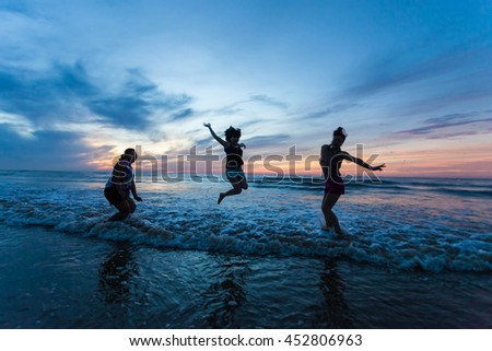 Thanh Hoa, Vietnam , Aug 13 2015 , group of friends splashing water in the sea at samson beach, Thanh Hoa. people and fun