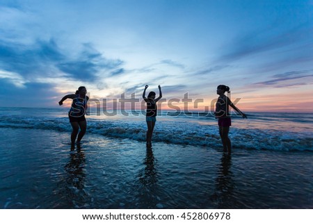 Thanh Hoa, Vietnam , Aug 13 2015 , group of friends splashing water in the sea at samson beach, Thanh Hoa. people and fun
