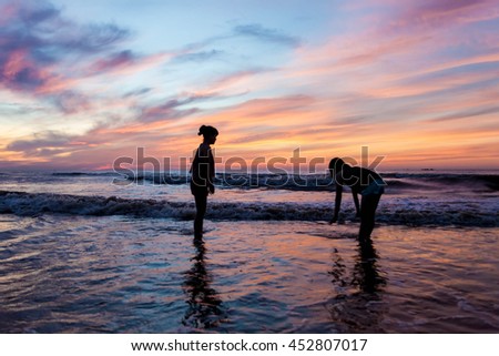 Thanh Hoa, Vietnam , Aug 13 2015 , group of friends splashing water in the sea at samson beach, Thanh Hoa. people and fun