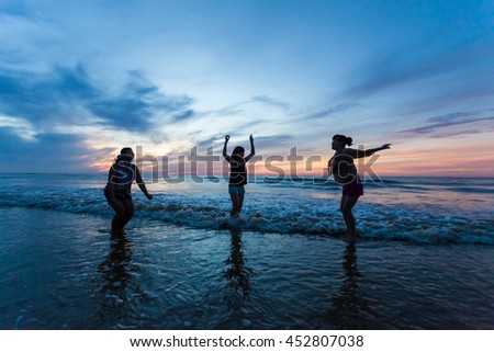 Thanh Hoa, Vietnam , Aug 13 2015 , group of friends splashing water in the sea at samson beach, Thanh Hoa. people and fun
