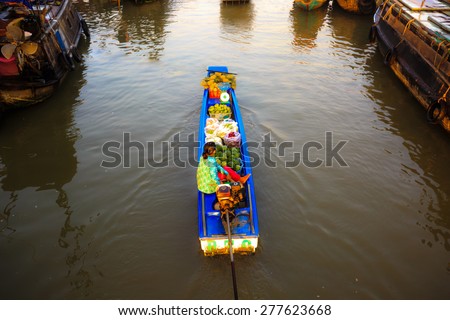 CAN THO, VIETNAM - FEBRUARY 5, 2015: Unidentified Vietnamese in Cai Rang Floating Market, Can Tho, Vietnam's southern province