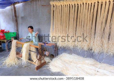 Ninh Thuan Province, Vietnam - February 27, 2016: at a craft village in Ninh Thuan province. Vietnam. A women weave the ropes from many papyrus fibers