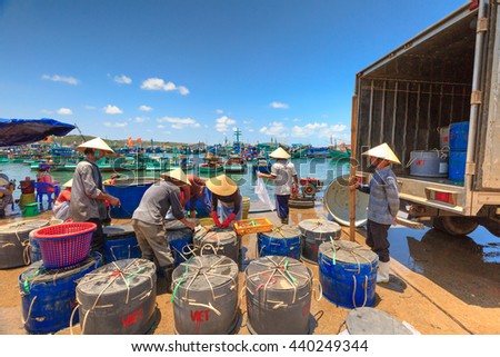 Phu Quoc island, Kien Giang province, Vietnam - May 02, 2016: People's daily life at the fishing village on Phu Quoc island, they collecting fresh fishes from boat and open up a market in the early