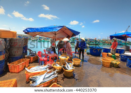 Phu Quoc island, Kien Giang province, Vietnam - May 02, 2016: People's daily life at the fishing village on Phu Quoc island, they collecting fresh fishes from boat and open up a market in the early