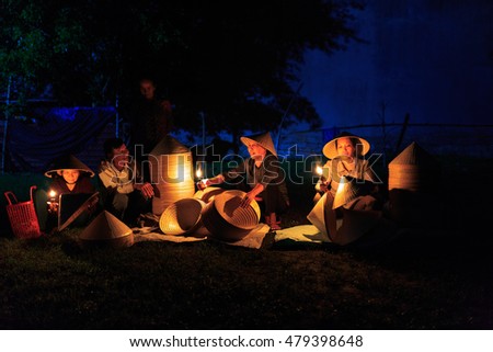 Binh Dinh Province, Vietnam - August 27, 2016: the image of a small market in the village with particular goods: specially buy traditional conical hats which are made from the craftsmen in the early