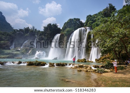 Ban Gioc waterfall, Cao Bang province, Vietnam - September 23, 2016 : tourists on boat at Ban Gioc waterfall in Cao Bang, Viet Nam. These are one of the nicest waterfalls in northern Vietnam.