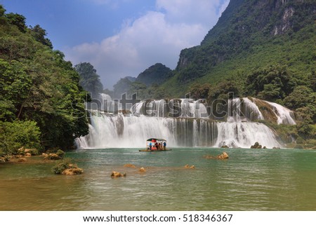 Ban Gioc waterfall, Cao Bang province, Vietnam - September 23, 2016 : tourists on boat at Ban Gioc waterfall in Cao Bang, Viet Nam. These are one of the nicest waterfalls in northern Vietnam.