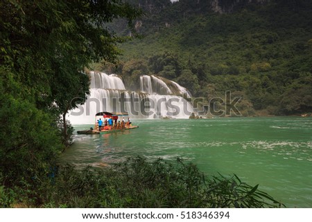 Ban Gioc waterfall, Cao Bang province, Vietnam - September 23, 2016 : tourists on boat at Ban Gioc waterfall in Cao Bang, Viet Nam. These are one of the nicest waterfalls in northern Vietnam.