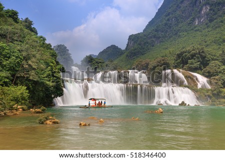 Ban Gioc waterfall, Cao Bang province, Vietnam - September 23, 2016 : tourists on boat at Ban Gioc waterfall in Cao Bang, Viet Nam. These are one of the nicest waterfalls in northern Vietnam.