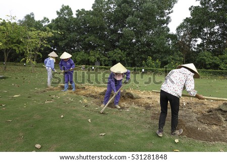 Flamingo Dai Lai, Vinh Phuc province, Vietnam - October 13, 2016 : The female workers who are working with the rudimentary tools at Flamingo Dai Lai resort of Vinh Phuc Province, Vietnam