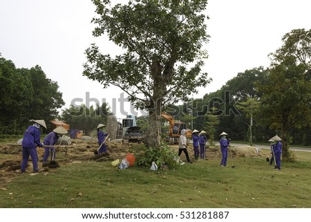 Flamingo Dai Lai, Vinh Phuc province, Vietnam - October 13, 2016 : The female workers who are working with the rudimentary tools at Flamingo Dai Lai resort of Vinh Phuc Province, Vietnam