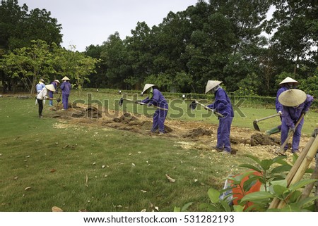 Flamingo Dai Lai, Vinh Phuc province, Vietnam - October 13, 2016 : The female workers who are working with the rudimentary tools at Flamingo Dai Lai resort of Vinh Phuc Province, Vietnam