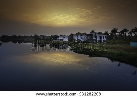 Flamingo Dai Lai, Vinh Phuc province, Vietnam - October 11, 2016 : calm lake reflection at sunset at Flamingo Dai Lai resort of Vinh Phuc Province, Vietnam